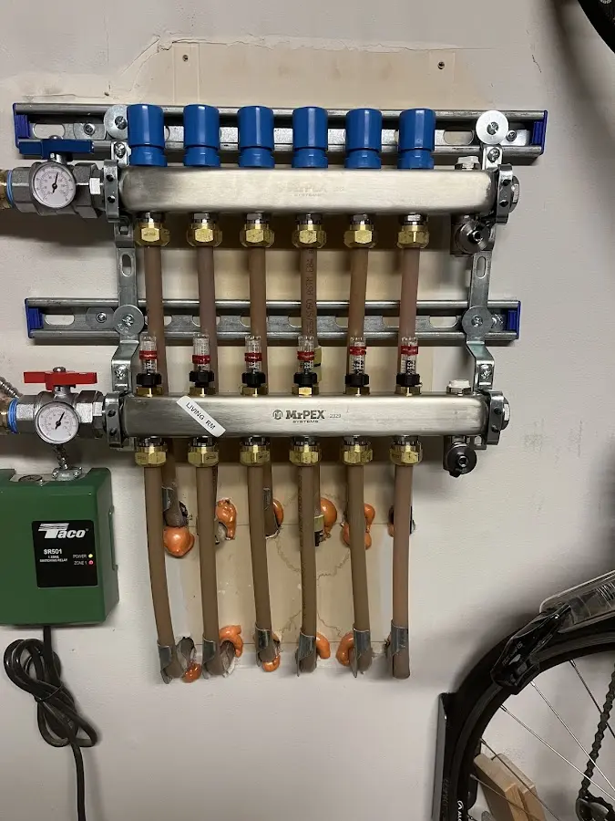 Plumber performing Water Heater Repair at a residential property in Norfolk